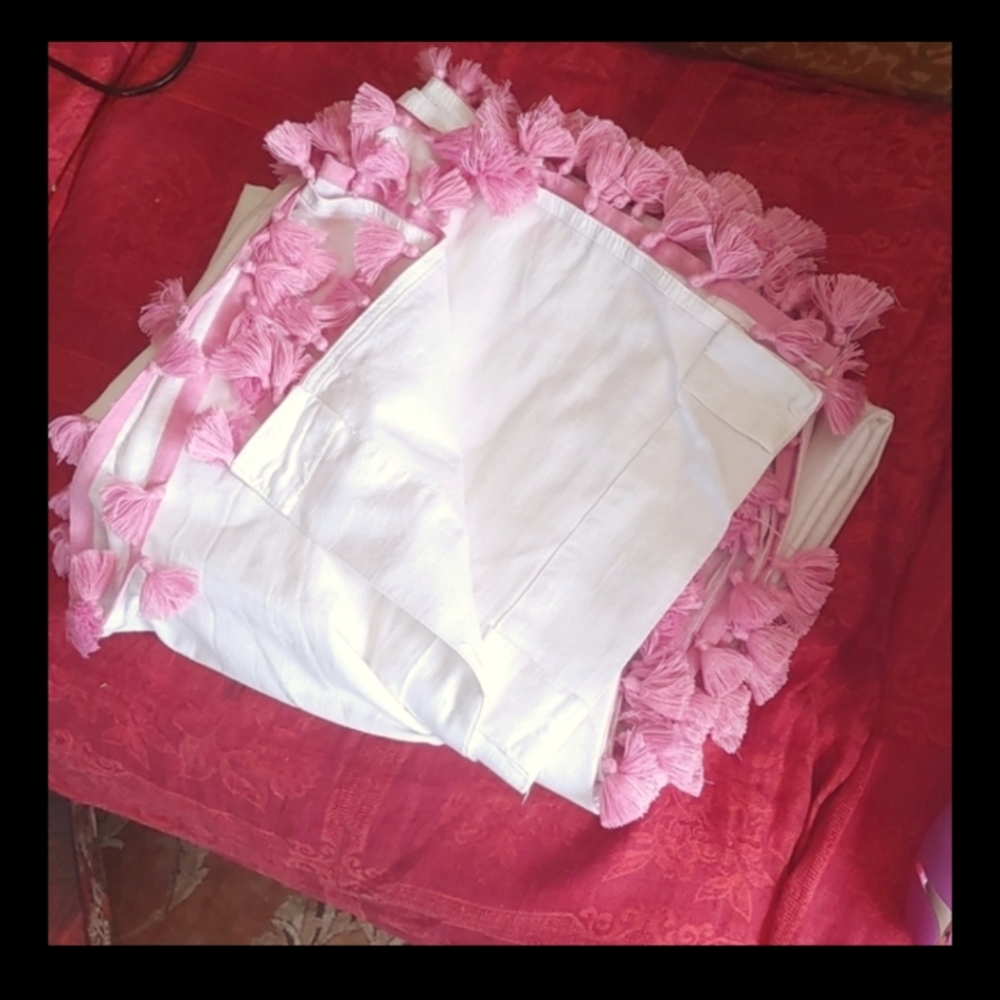 1 set (2 panels) pink tassel edged white curtains. 8ft.